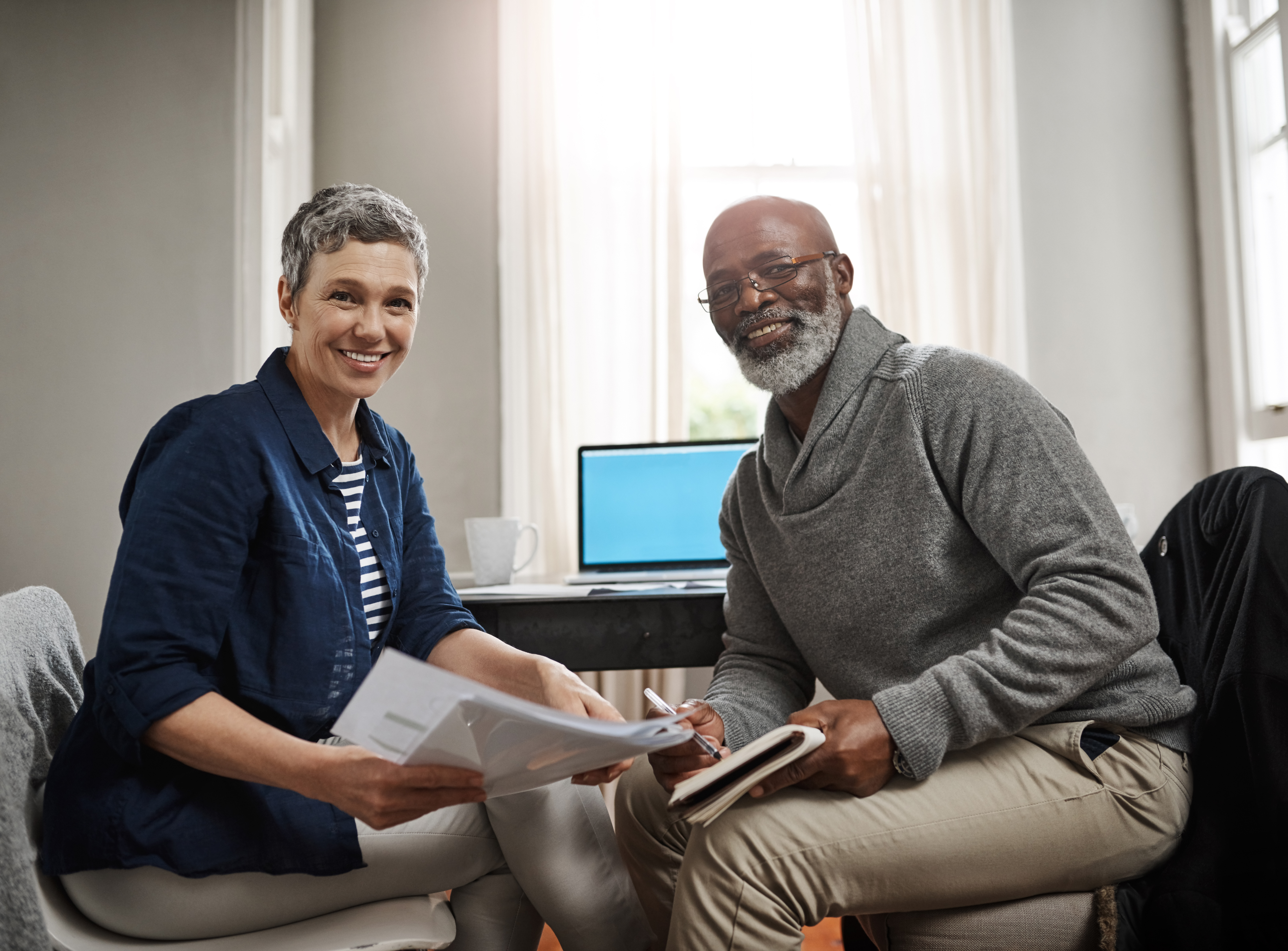 Couple_reviewing_finances_at_home_AdobeStock_602868345