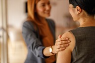 Woman_supportive_gesture_AdobeStock_1646006202