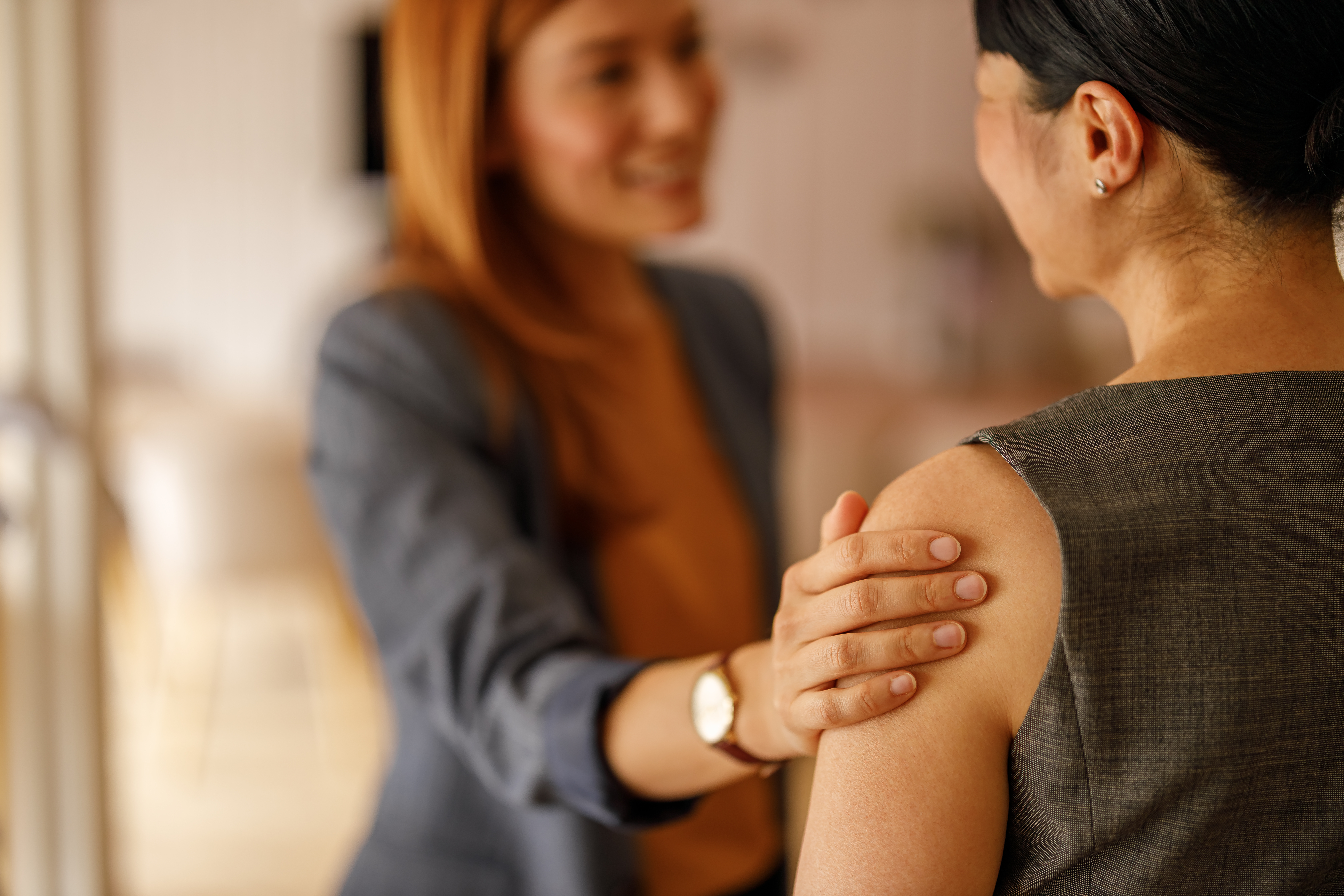 Woman_supportive_gesture_AdobeStock_1646006202